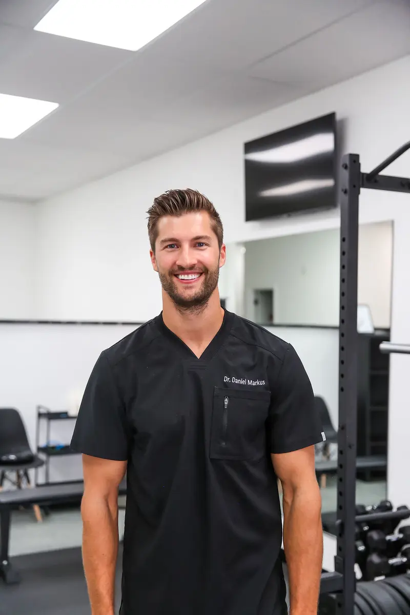 Dr. Daniel Markus providing headache treatment in Tempe chiropractic clinic